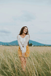 Smiling girl in a field in Colorado