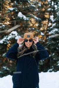 Smiling girl with white teeth on a snow hike in Boulder, Colorado
