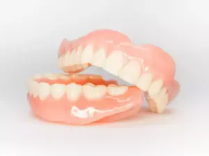 Traditional dentures, upper and lower.