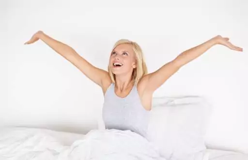 Woman waking up smiling